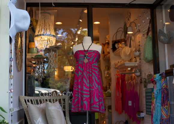 boutique storefront with dresses and accessorites