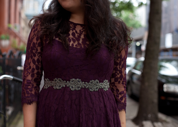 close up of anthropologie belt and purple lace free people dress