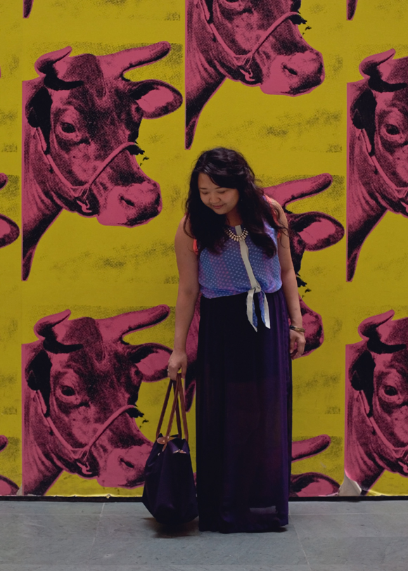 fashion blogger purple outfit posing at the moma andy warhol cow wallpaper