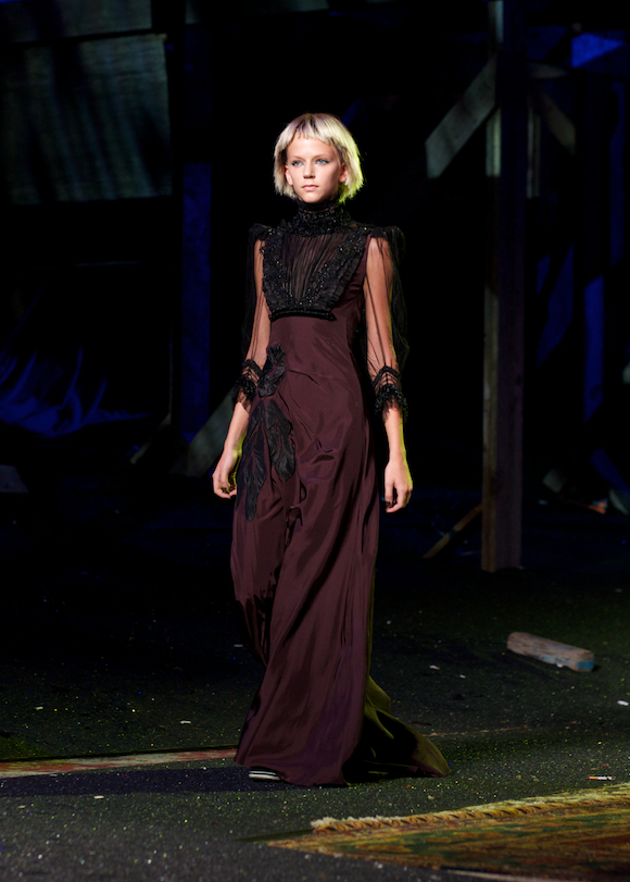 marc jacobs spring 2014 model walks the runway in a burgundy and black dress