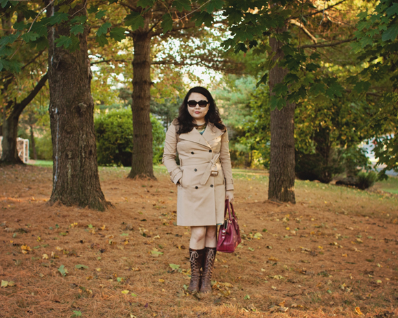 walking in the woods in a club monaco trench coat, frye boots and coach legacy molly satchel