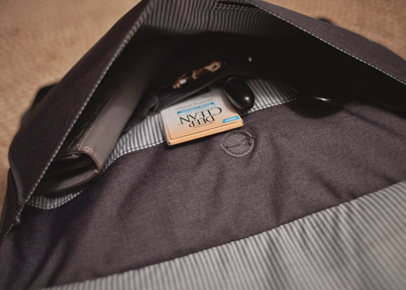 Small outer pocket of the brenthaven collins slim brief packed with beauty essentials and stewart/stand wallet