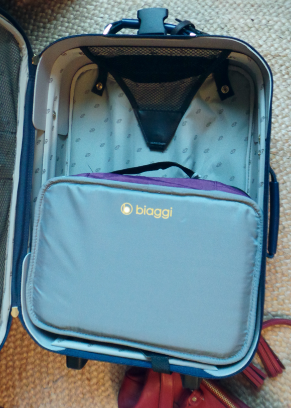 packing away my biaggi zipsak after a trip. fits inside my other carry on!