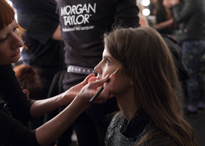 A model having her makeup done at Karolyn Pho Fall 2014.