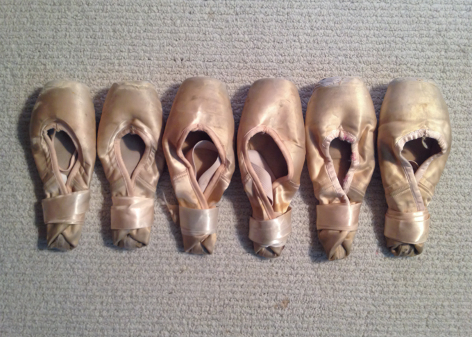 a row of old pointe shoes