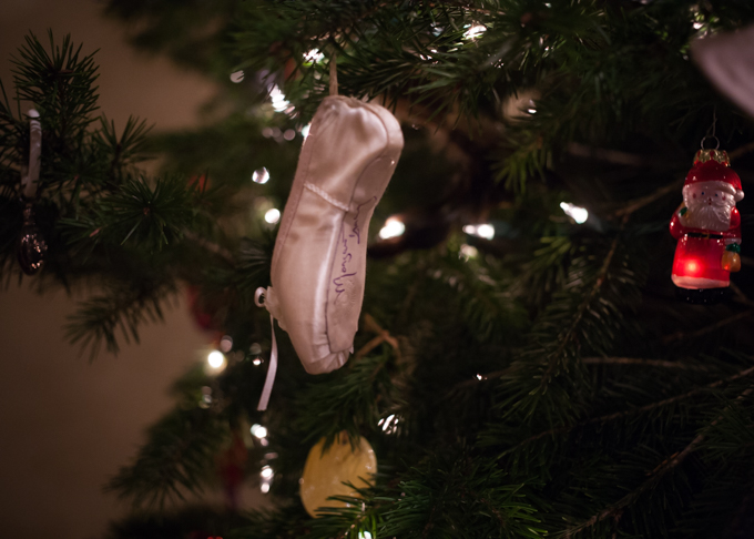 pointe shoe ornament signed by margaret tracey hanging on the tree