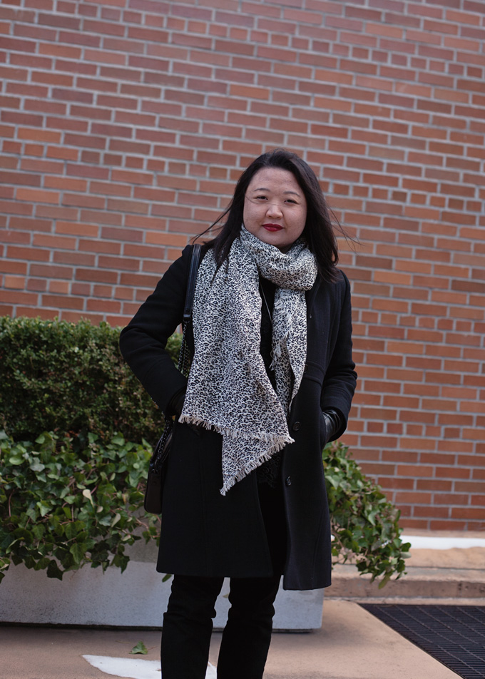 Black and white leopard scarf with black coat and jeans