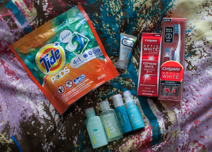 influenster xo vox box with tide pods, skinfix hand dream, colgate toothpaste, and john frieda beach blonde hair products