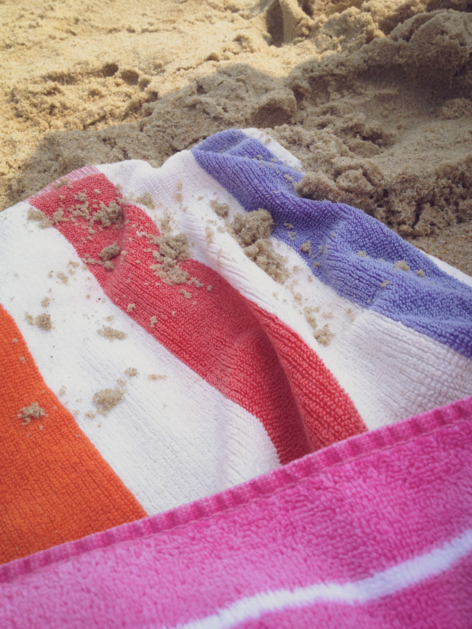 beach blanket with sand