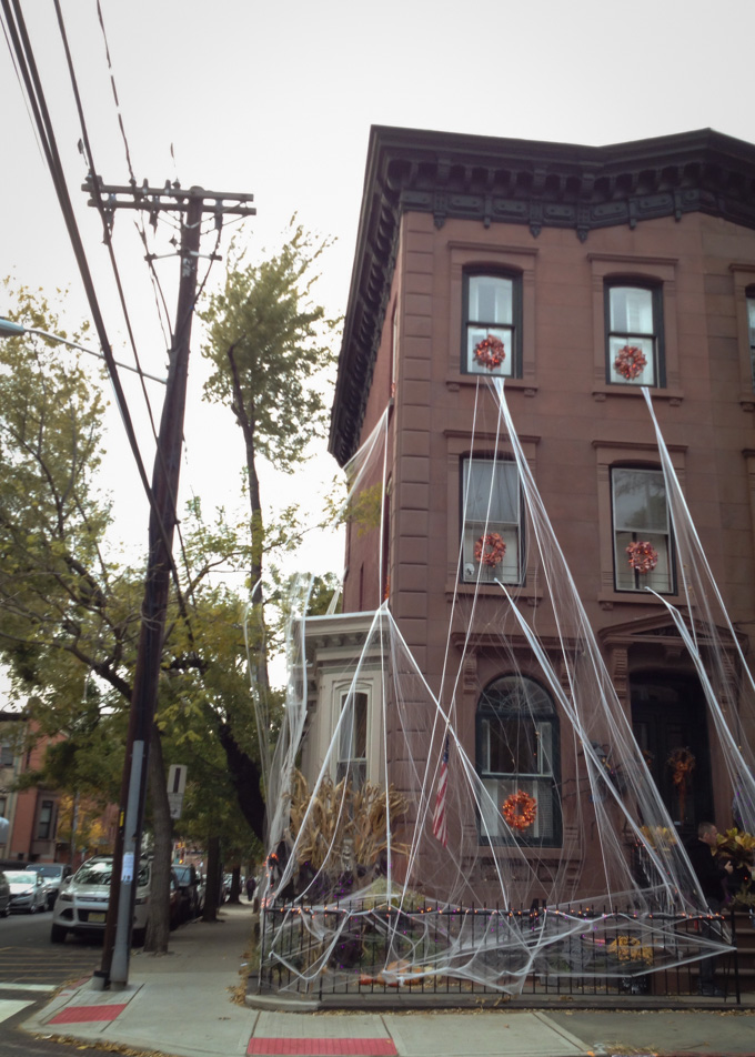 spider webs decorating a house for halloween