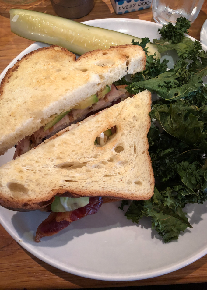 Sandwich and kale chips at brunch.