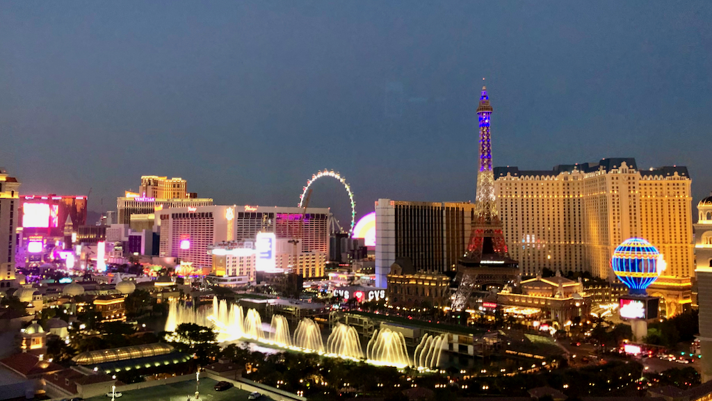 Photo of the Las Vegas strip and Bellagio fountains at blue hour.